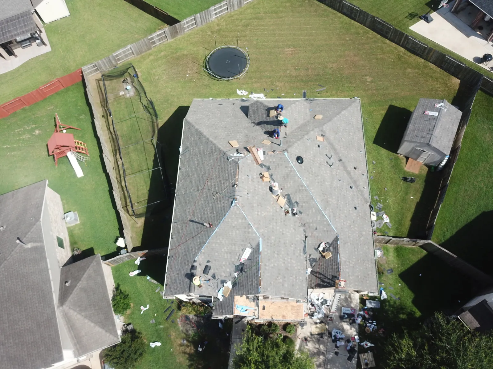 A roof mid-replacement by Now Roofing after an approved insurance claim in Greater Houston